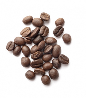 Roasted coffee beans isolated on white background. Close-up image.